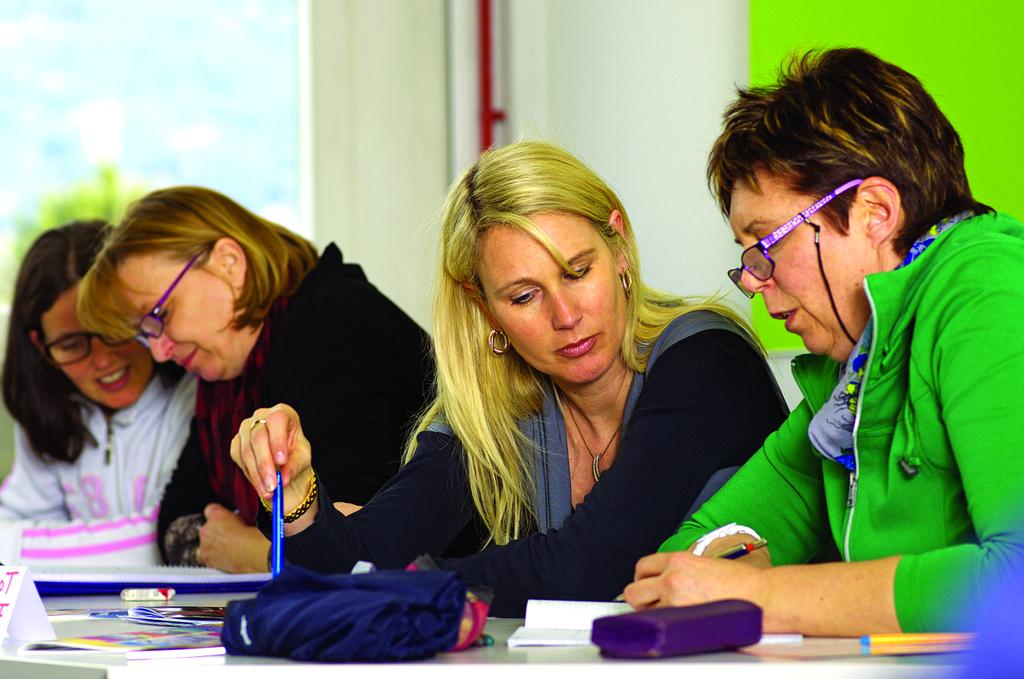 Group of diverse students learning together