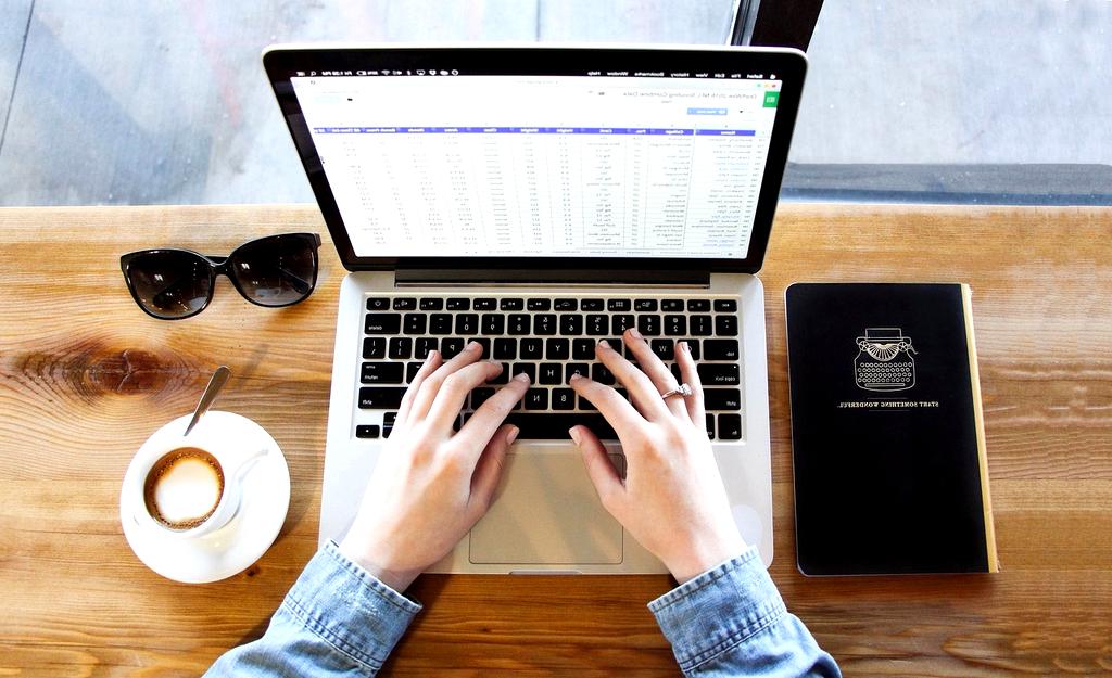 Person coding on laptop