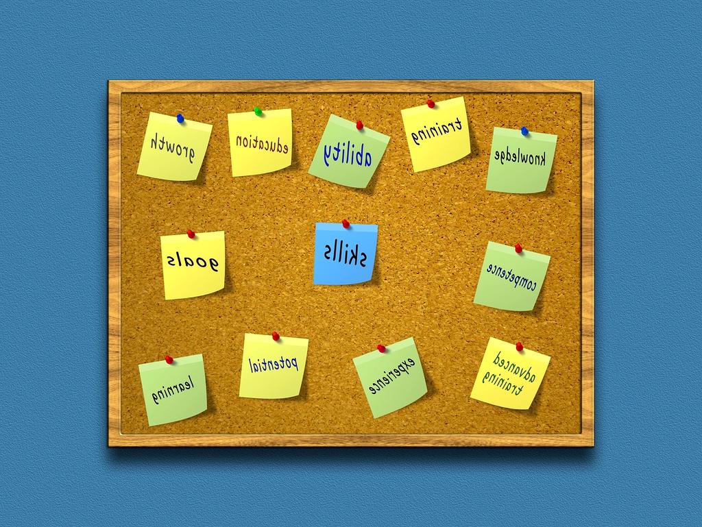 Person learning basic computer skills at desk